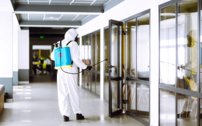 Disinfection of office to prevent COVID-19, Disinfection of office to prevent COVID-19, Man in protective hazmat suit with with spray chemicals to preventing the spread of coronavirus, pandemic in quarantine city. Cleaning concept.